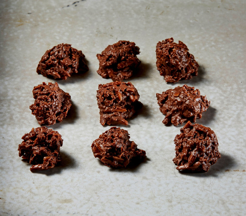 9 Milk Chocolate Almond Clusters on a patinaed counter top