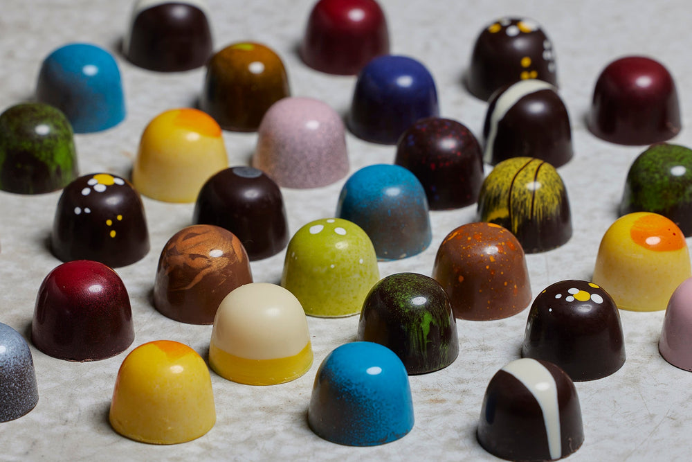 
                  
                    A tray full of assorted beautifully hand painted bonbons
                  
                